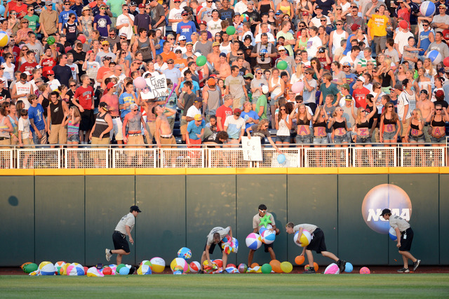 WATCH: Fan jumps onto field at College World Series, immediately tackled